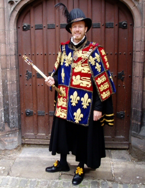 John Neitz as Garter King of Arms